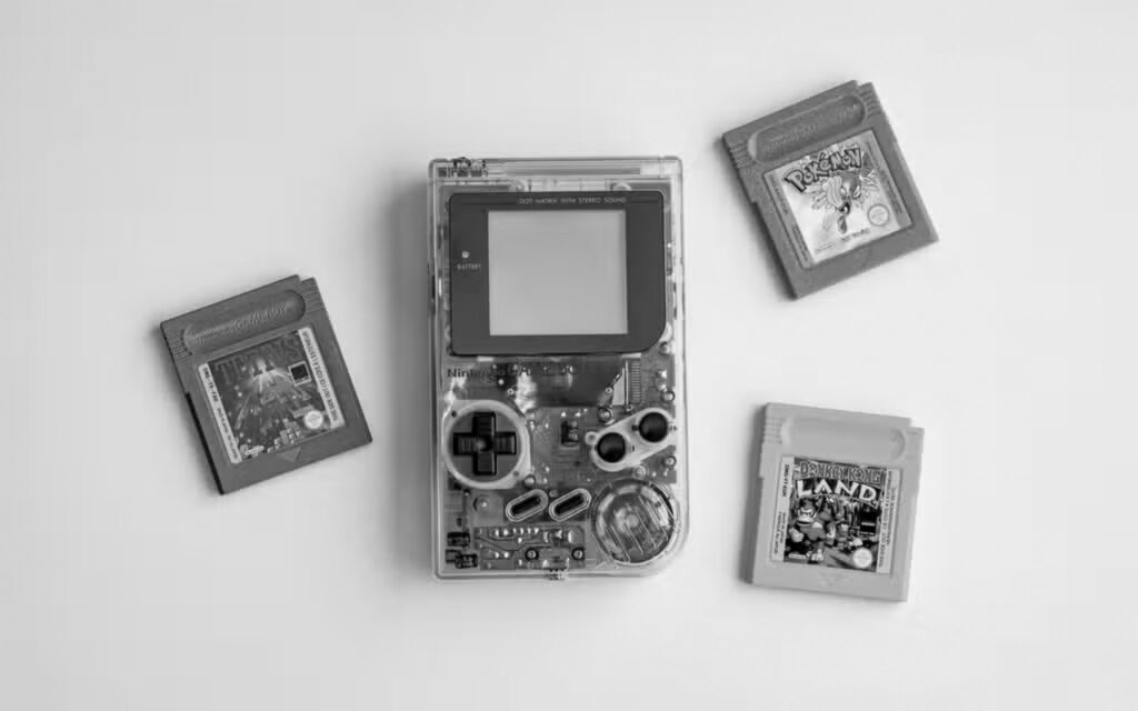 Nintendo gameboy original and 3 games including tetris and pokemon