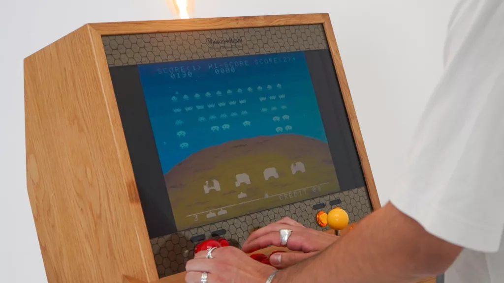 original space invaders game played on a wooden arcade machine